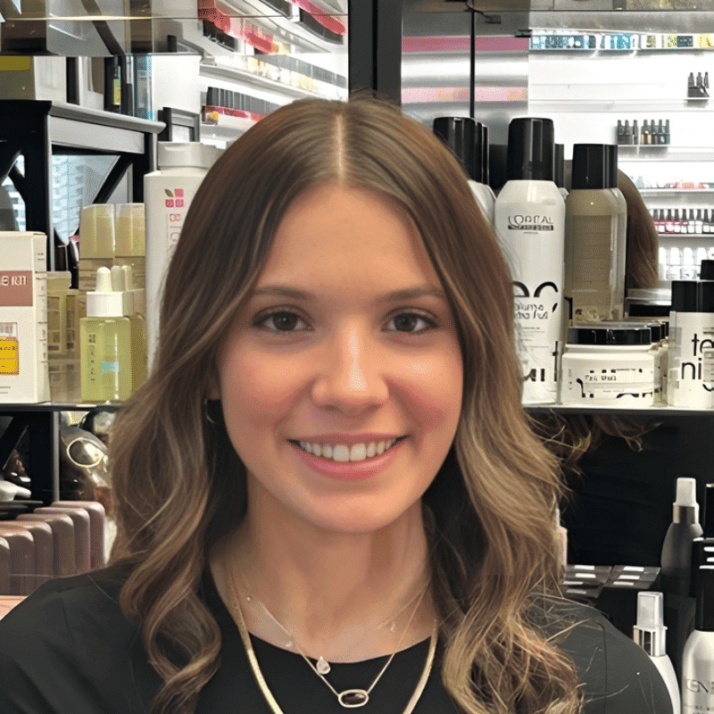 Portrait of Isabella, a professional stylist at A Finished Appearance, showcasing their expertise and style.