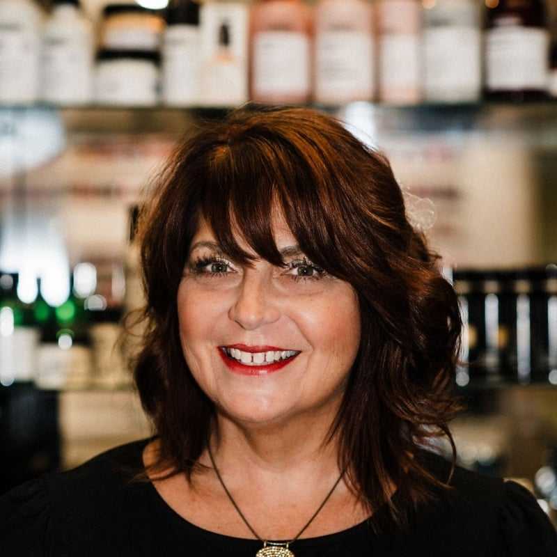 Portrait of Diane Fellers, a professional stylist at A Finished Appearance, showcasing their expertise and style.