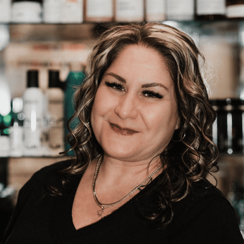 Portrait of Kimmy Trentin, a professional stylist at A Finished Appearance, showcasing their expertise and style.