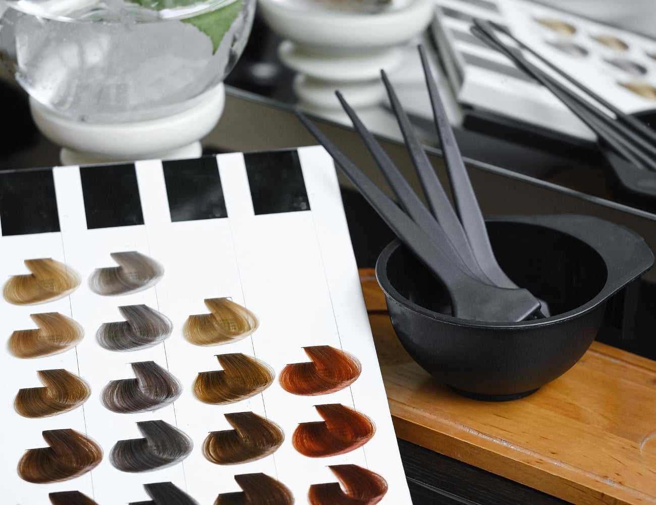 Hair color swatches and tools in a salon setting.